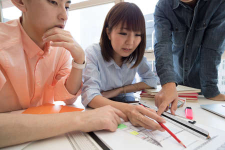 The businessman will meeting while pointing to the document.の写真素材