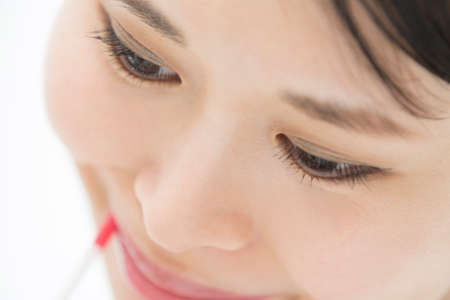 Lip-gloss On Lip To Make Asian Girl Beautifulの写真素材