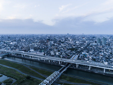 Aerial photograph of the river and city. Blue time.