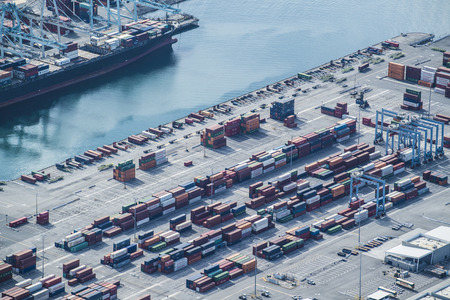 Aerial shooting of large container ships and cranes. evening.の写真素材