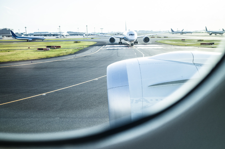 Snapshot of airport. From the window of the aircraft.の写真素材