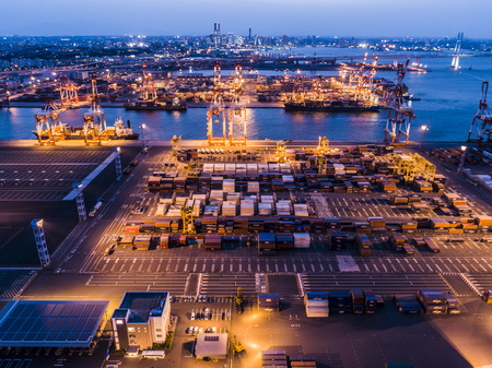 Aerial view of the night view of the container area. Lighted up crane.の写真素材