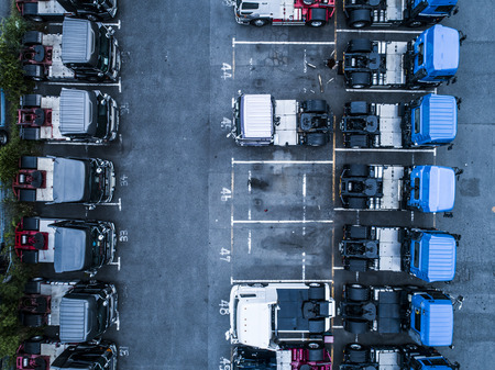 Lots of parked trucks. Aerial shooting from directly above.