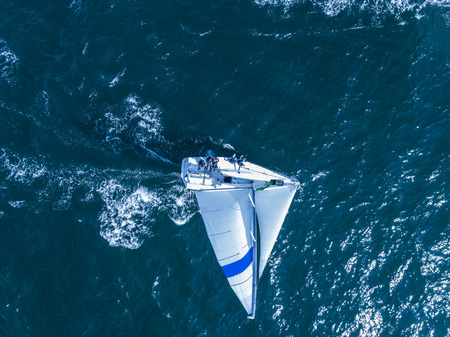 A sailing ship receiving the wind. Aerial view of the sea.の写真素材