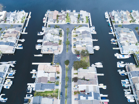 Aerial view of a resort town in the waterside. House with private boat.の写真素材