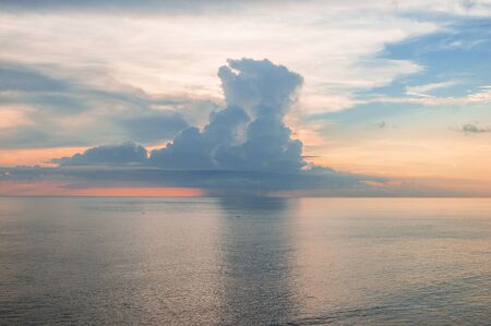 Beautiful coastal landscape pink sunrise on the endless ocean with the colors of rose quartz and serenityの写真素材