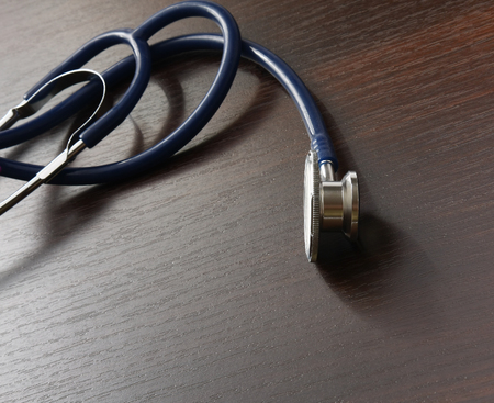 Stethoscope on wodden desk, closeupの写真素材