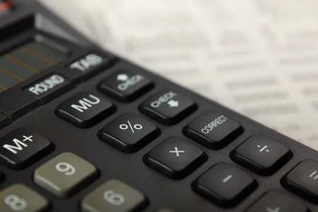 Calculator, pen, folder with documentsの写真素材