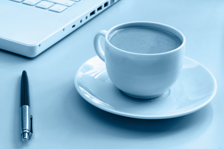 Cup of coffee near pressの写真素材