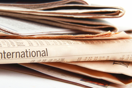 stack of Newspapers on white 