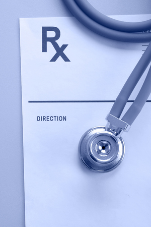 Closeup of a stethoscope on a rx prescription, blueprintの写真素材