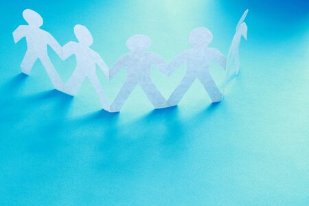 Paper cut people, isolated on blue background