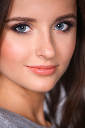 Portrait of an attractive fashionable young brunette womanの写真素材
