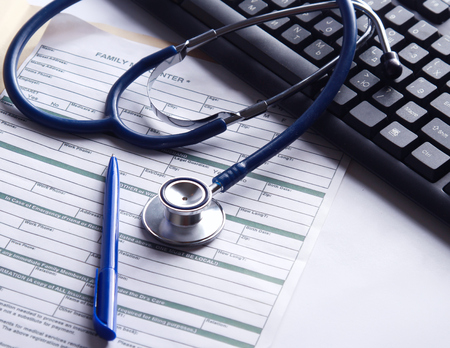 A stethoscope on a laptop computer.の写真素材