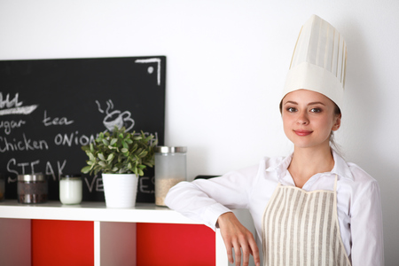 Chef woman portrait with  uniform in the kitchen .の写真素材