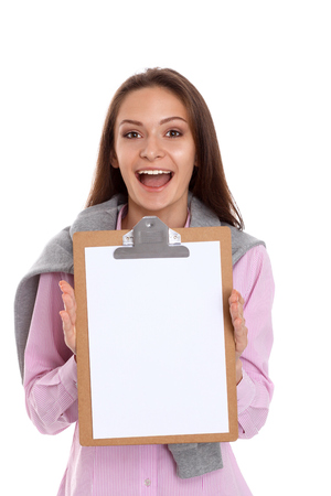 Studio portrait of a confident young female professional holding a clipboardの写真素材