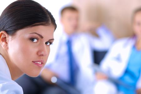 Happy medical team discussing and working together .の写真素材