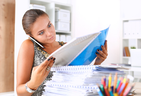 Fashion designers working in studio sitting on the desk .の写真素材
