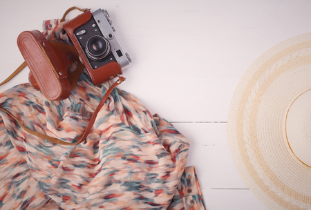 Woman clothing and accessories placed on a wooden backgroundの写真素材