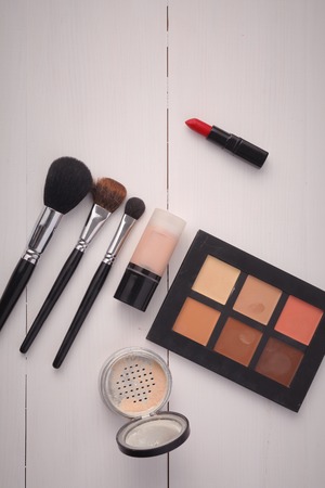 Makeup brush and cosmetics, on a white backgroundの写真素材