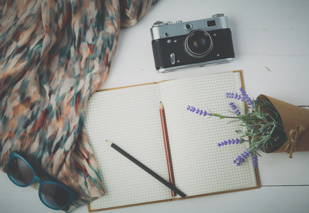 Woman clothing and accessories placed on a wooden backgroundの写真素材