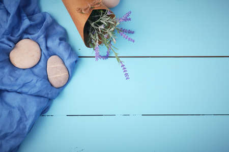 Stones and plant on the wooden backgroundの写真素材