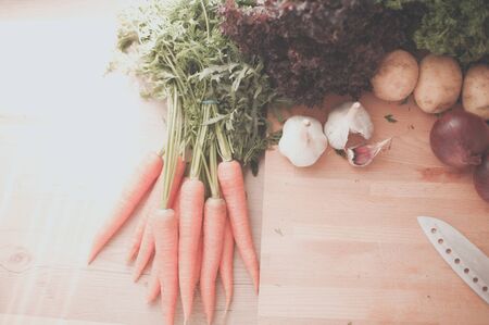 Vegetables on the desk in a kitchenの写真素材