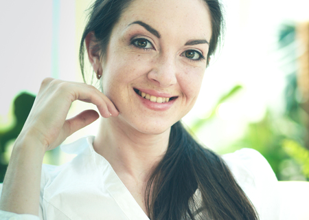 A young woman sitting in office buildingの写真素材