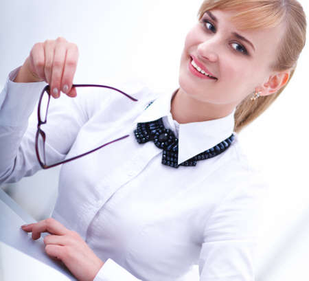 Portrait of  businesswoman sitting at  desk with a laptopの写真素材