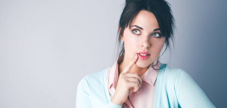 Portrait of an attractive fashionable young brunette womanの写真素材