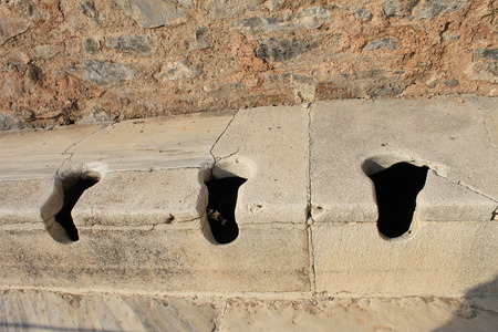 Public toilet in Ephesus antique ruins of the ancient city in the province of Selcuk, Turkeyの写真素材