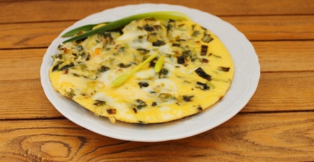 Omelet with spinach cooked in olive oilの写真素材