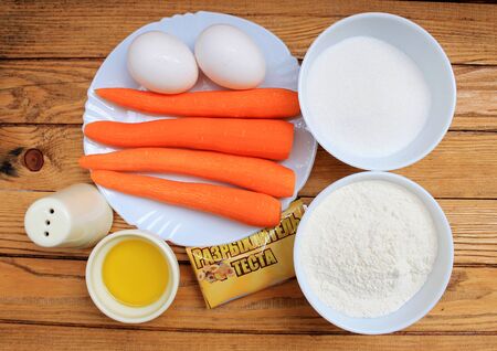 The ingredients for carrot cake: carrots, eggs, flour and sugarの写真素材