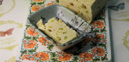 National popular Turkish sweet takhinna halva. The famous Turkish tahini halva with pistachios.