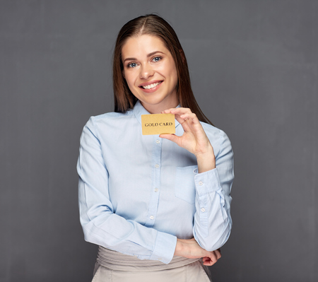 Young woman holding credit card.の写真素材