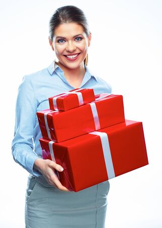 Business woman with gift boxes isolated white background portrait.の写真素材