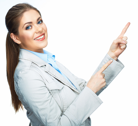 Smilinf business woman pointing on space. Isolated white background.の写真素材
