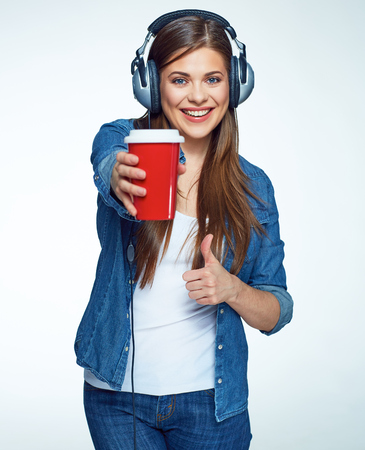 Beautiful girl listening music with coffee glass.の写真素材
