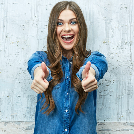 Happy woman show thumb up.の写真素材