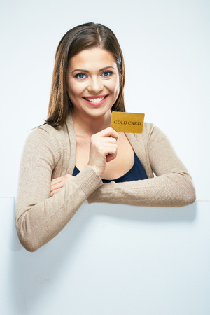 woman show a Credit card. Isolated portrait with copy space.の写真素材