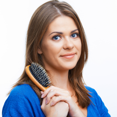 Isolated portrait of a beautiful young woman hairdresser, long hair
