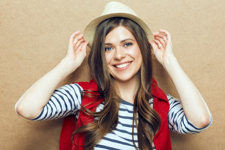 Portrait of young woman wearing hat. Smiling female model.の写真素材
