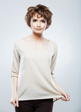 Fashion model woman posing in studio. Young model with short hair. Portrait of young beautiful woman.の写真素材