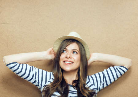 Portrait of young modern woman wearing hat. Smiling girl.の写真素材
