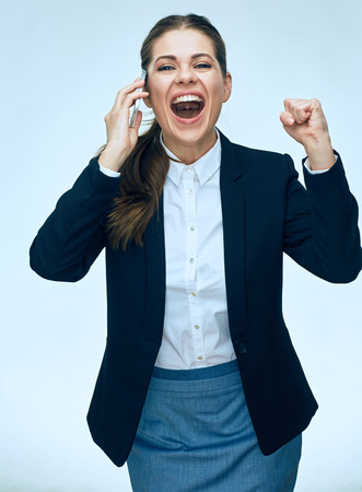 Emotional business woman phone talk. Isolated portrait. Business suit.の写真素材