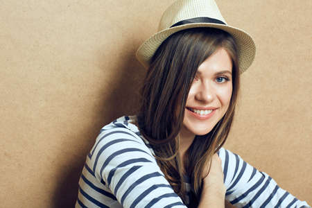 Close up portrait of smiling girl wearing hat and striped shirt.の写真素材
