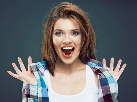 Portrait of happy young woman in casual style dressed. Studio isolated.の写真素材