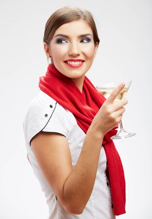 Young happy woman with glass. Beautiful model portrait isolated over studio backgroundの写真素材
