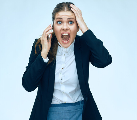 Stress woman in business. Phone talking business woman in stress. Business suit.の写真素材