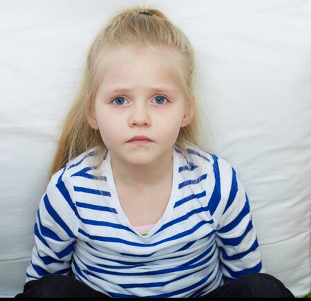 Little girl portrait . Kid lying and relax.